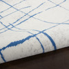 4' x 6' Blue and Ivory Abstract Dhurrie Polypropylene Area Rug