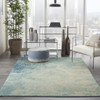 5' x 7' Ivory and Blue Abstract Power Loom Area Rug