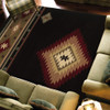 5' x 8' Black and Green Southwestern Power Loom Stain Resistant Area Rug