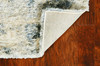 5' x 8' Ivory Blue Machine Woven Abstract Indoor Area Rug