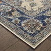 6' x 9' Ivory and Blue Oriental Power Loom Stain Resistant Area Rug