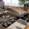 5' Beige and Black Round Floral Power Loom Distressed Area Rug