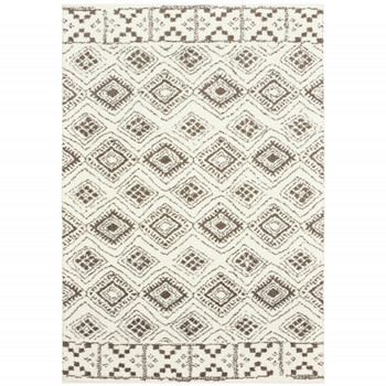 5' x 8' Ivory and Brown Geometric Shag Power Loom Stain Resistant Area Rug