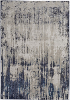 5' x 8' Tan Blue and Ivory Abstract Power Loom Distressed Area Rug