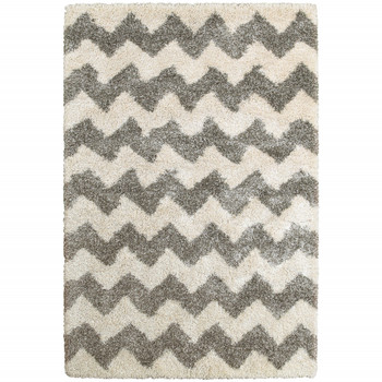 5' x 8' Grey and Ivory Geometric Shag Power Loom Polypropylene Area Rug