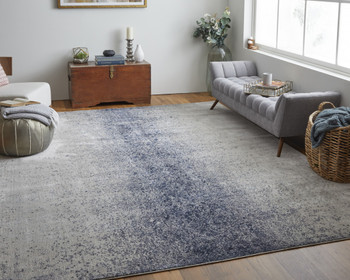 7' x 10' Ivory and Blue Abstract Power Loom Area Rug