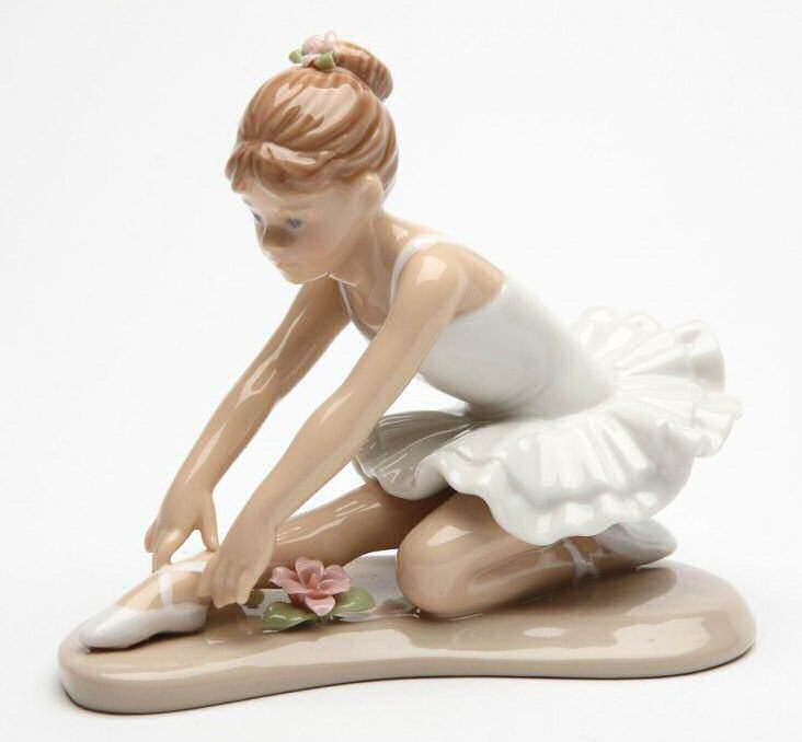 Young Ballerina in White Sitting and Stretching Porcelain Sculpture