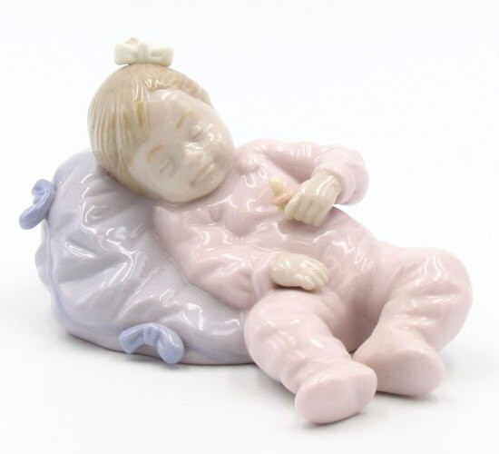 Little Girl Sleeping on a Pillow Porcelain Sculpture by Nadal