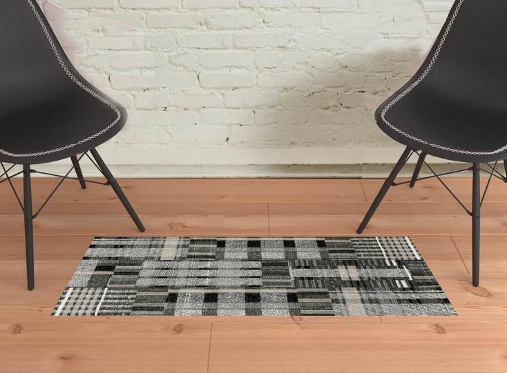 2' x 3' Black Grey and Ivory Geometric Power Loom Stain Resistant Area Rug