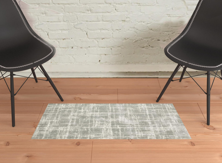 2' x 3' Grey and Ivory Abstract Shag Power Loom Stain Resistant Area Rug