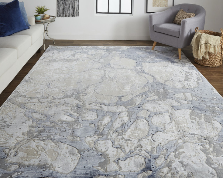 2' x 3' Ivory and Blue Abstract Power Loom Distressed Area Rug