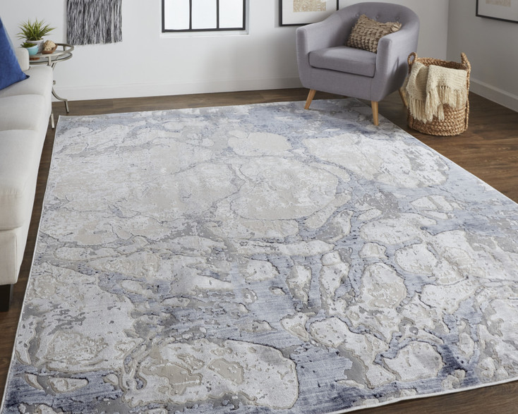 2' x 3' Ivory and Blue Abstract Power Loom Distressed Area Rug