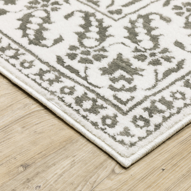2' x 8' Grey and White Floral Power Loom Stain Resistant Runner Rug