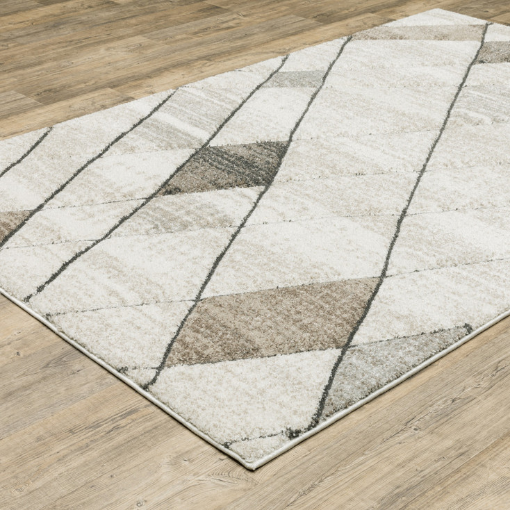 3' x 5' Beige Grey Tan and Brown Geometric Power Loom Stain Resistant Area Rug