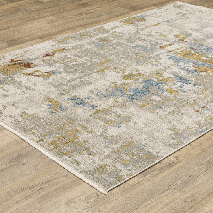 4' x 6' Beige Grey Gold Blue Rust and Teal Abstract Power Loom Area Rug with Fringe