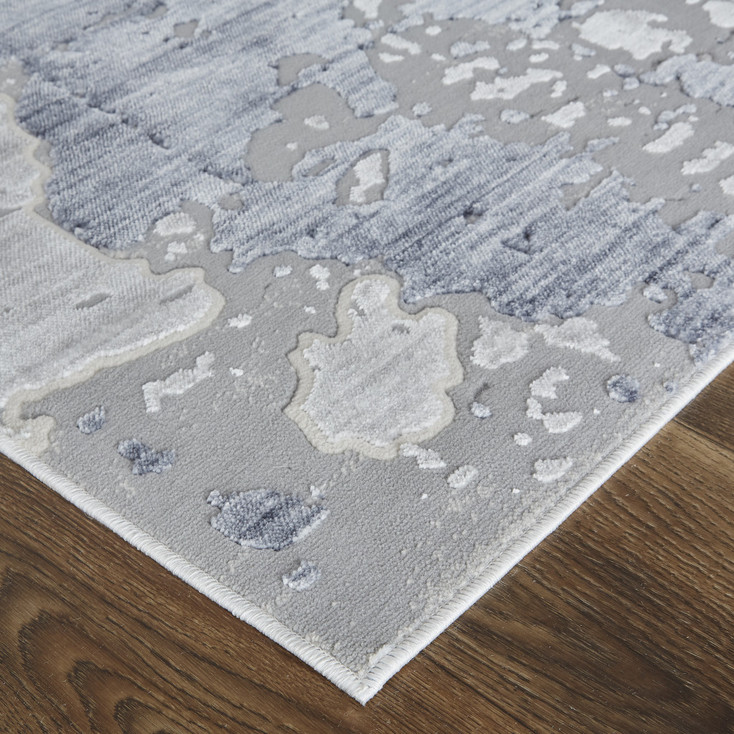 4' x 6' Ivory and Blue Abstract Power Loom Distressed Area Rug