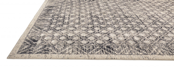 4' x 6' Ivory Black and Taupe Abstract Stain Resistant Area Rug