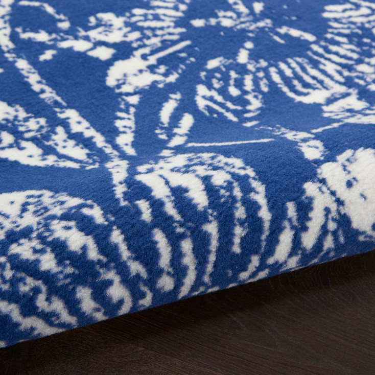 5' x 7' Navy Blue Floral Dhurrie Polypropylene Area Rug