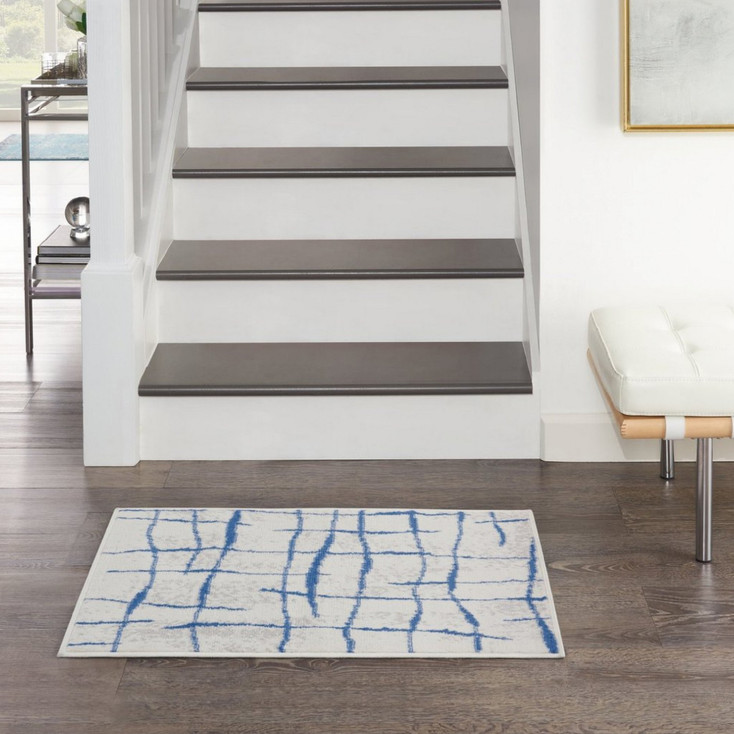 5' x 7' Blue and Ivory Abstract Dhurrie Polypropylene Area Rug