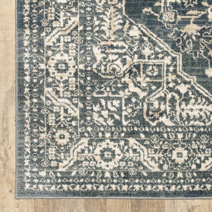 5' x 7' Beige Grey and Blue Oriental Power Loom Stain Resistant Area Rug