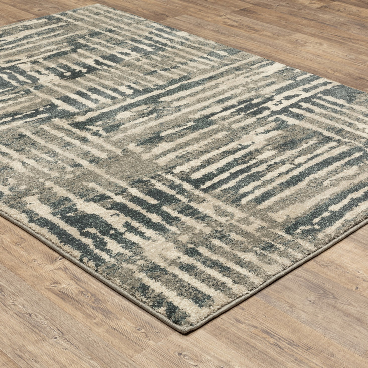 5' x 7' Blue and Beige Abstract Power Loom Stain Resistant Area Rug