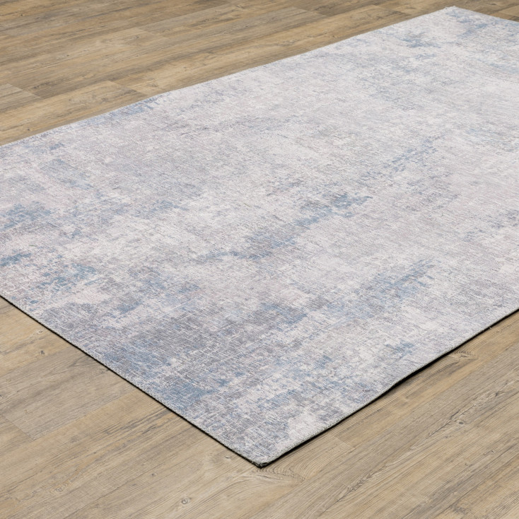 5' x 7' Grey and Blue Abstract Power Loom Stain Resistant Area Rug