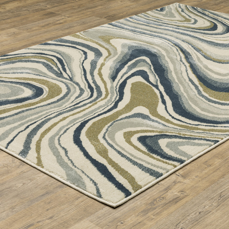 5' x 7' Ivory Blue and Beige Abstract Power Loom Stain Resistant Area Rug