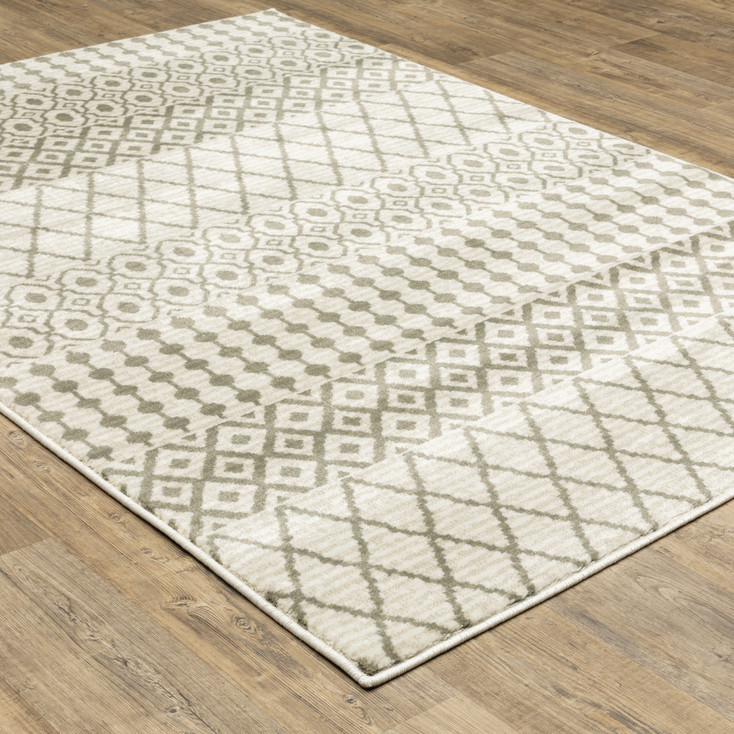 5' x 7' Ivory and Grey Geometric Power Loom Stain Resistant Area Rug