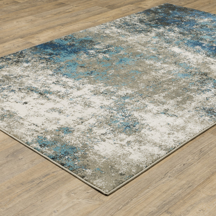 5' x 7' Blue Grey and Beige Abstract Power Loom Stain Resistant Area Rug