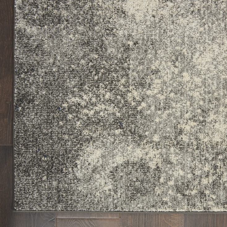 5' x 7' Gray and Ivory Abstract Power Loom Area Rug