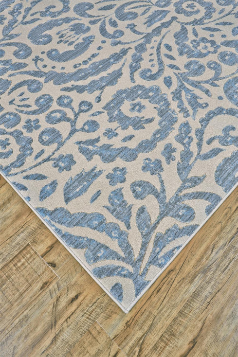 5' x 8' Blue Ivory and Tan Floral Distressed Stain Resistant Area Rug