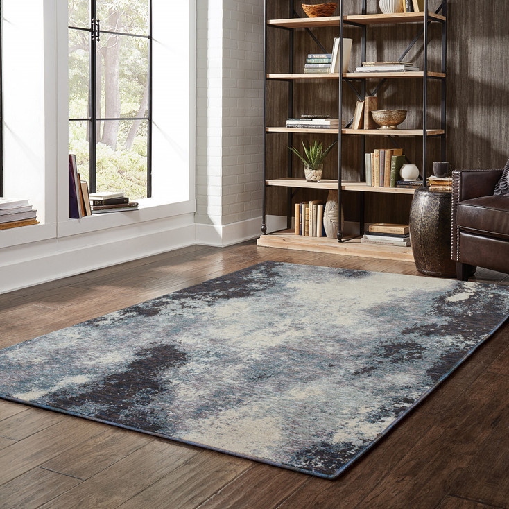 5' x 8' Navy and Ivory Abstract Power Loom Stain Resistant Area Rug