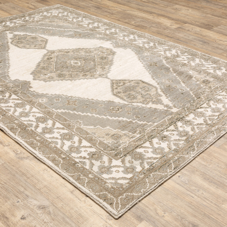 5' x 8' Beige and Ivory Oriental Power Loom Stain Resistant Area Rug