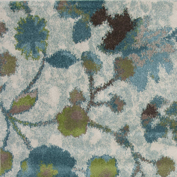 5' x 8' Teal Blue Machine Woven Floral Indoor Area Rug