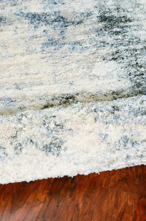 5' x 8' Ivory Blue Machine Woven Abstract Indoor Area Rug