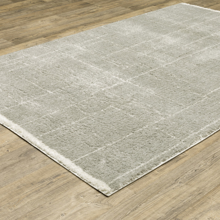 5' x 8' Grey & Ivory Geometric Shag Power Loom Stain Resistant Area Rug