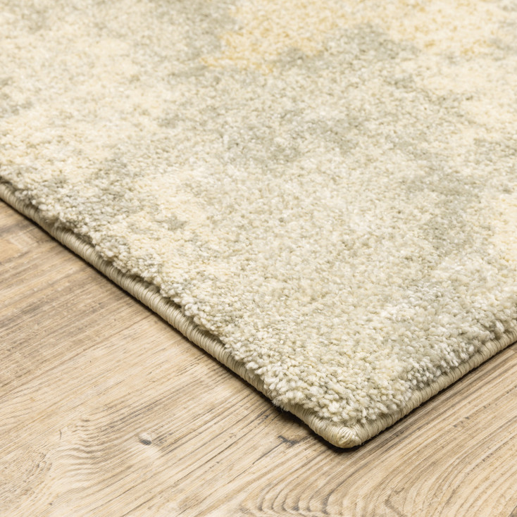 5' x 8' Grey Ivory Beige and Taupe Abstract Power Loom Stain Resistant Area Rug