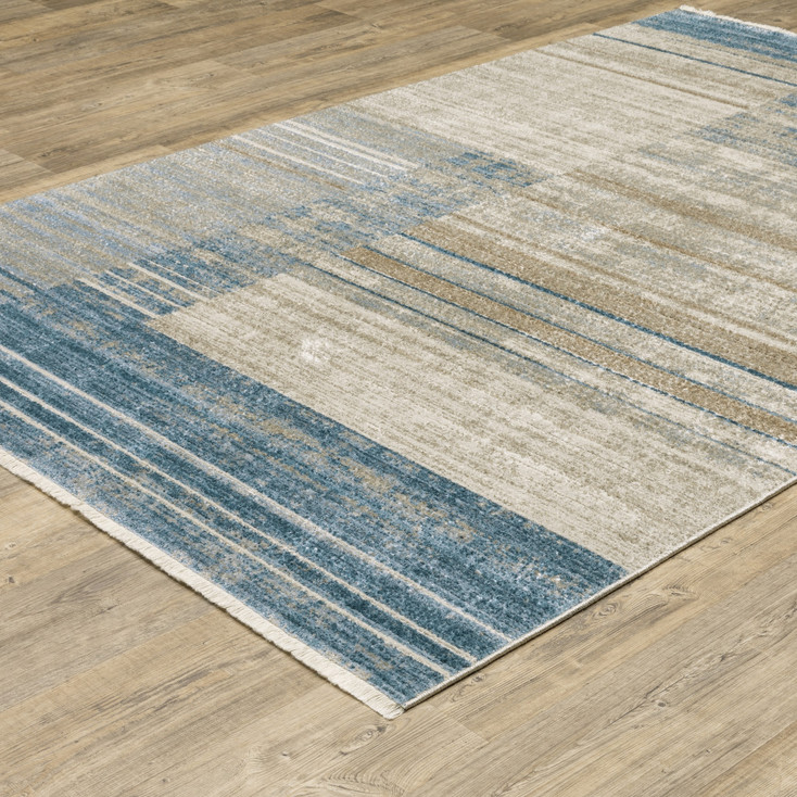 5' x 8' Blue Dark Blue Teal Grey Ivory Beige and Tan Geometric Power Loom Area Rug