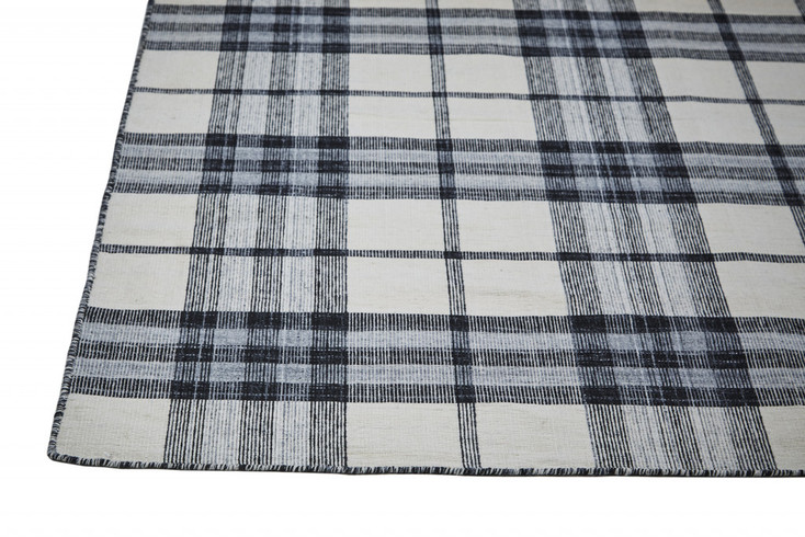 5' x 8' Ivory Blue and Black Abstract Hand Woven Stain Resistant Area Rug