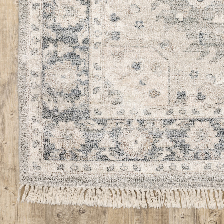5' x 8' Beige and Grey Oriental Hand Loomed Stain Resistant Area Rug with Fringe