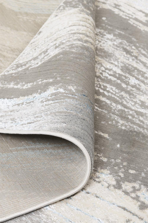 5' x 8' Gray Ivory and Blue Abstract Stain Resistant Area Rug