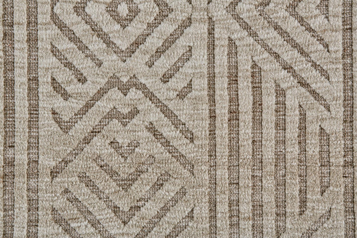5' x 8' Tan Ivory and Brown Geometric Stain Resistant Area Rug