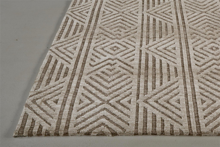 5' x 8' Tan Ivory and Brown Geometric Stain Resistant Area Rug