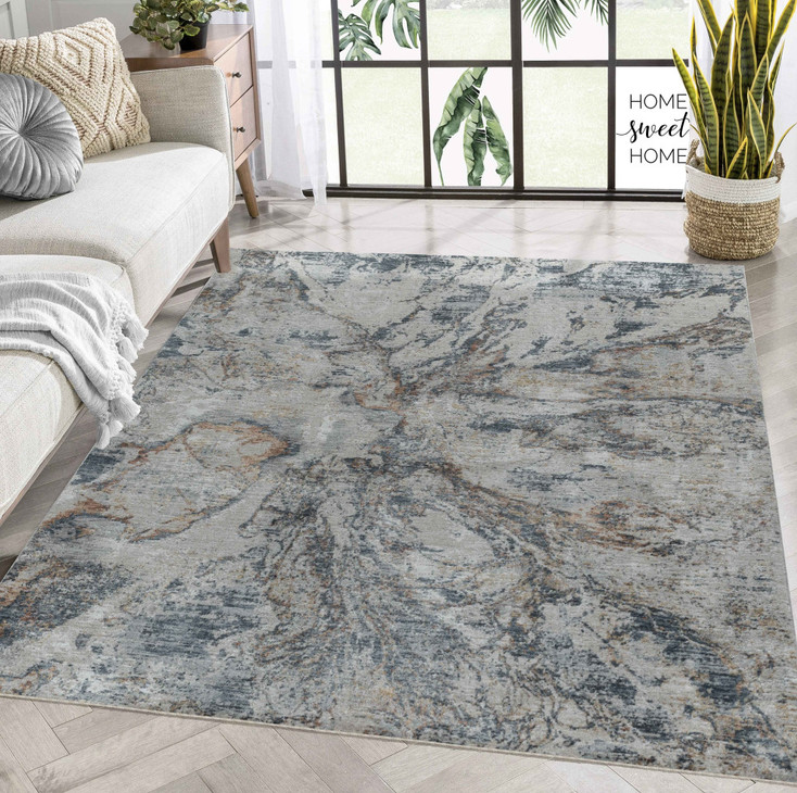 5' x 8' Beige and Blue Abstract Power Loom Area Rug