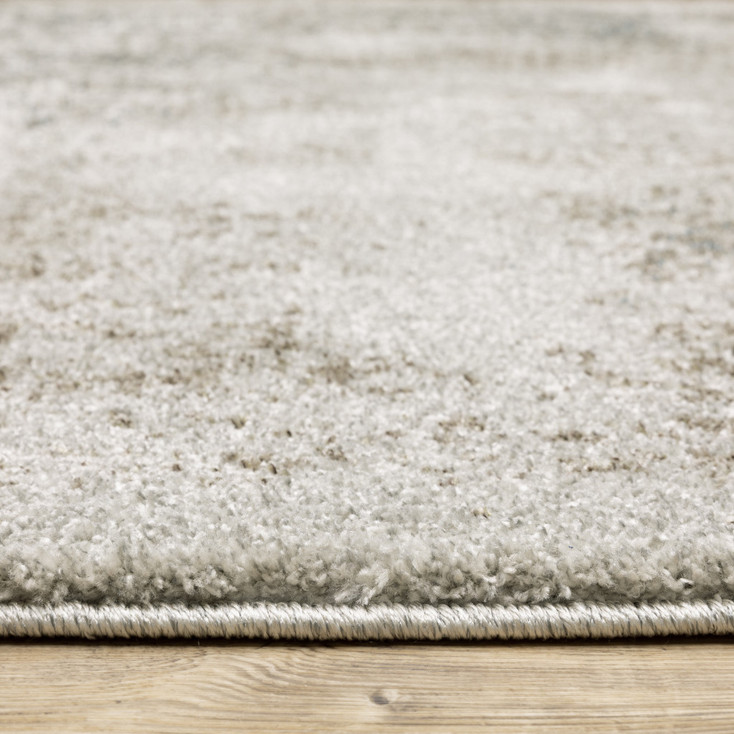 5' x 8' Grey Beige and Teal Oriental Power Loom Stain Resistant Area Rug