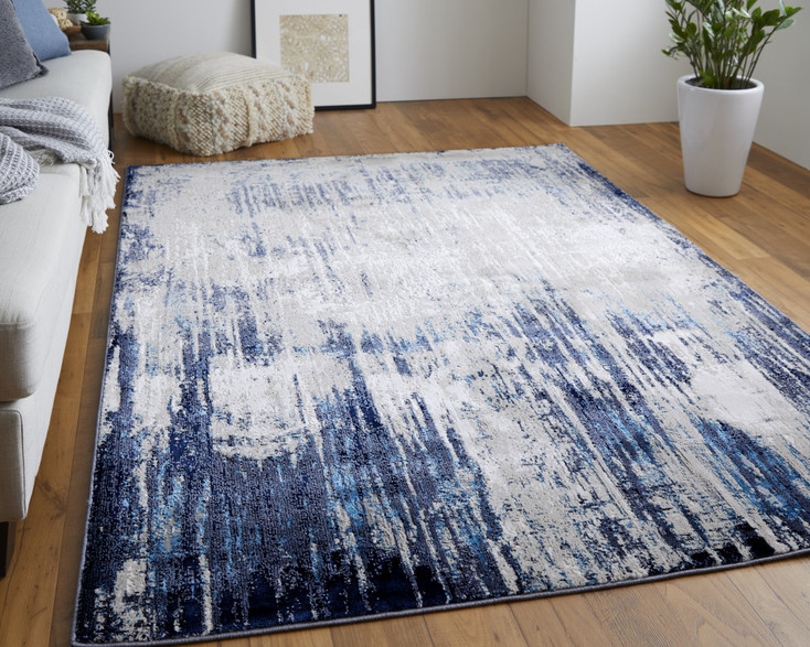 5' x 8' Tan Blue and Ivory Abstract Power Loom Distressed Area Rug