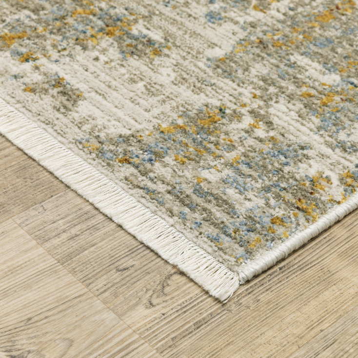 5' x 8' Beige Grey Gold Blue Rust and Teal Abstract Power Loom Area Rug with Fringe