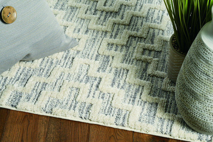 5' x 8' Ivory Grey Machine Woven Geometric with Fringe Indoor Area Rug
