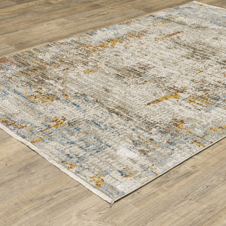 5' x 8' Beige Grey Brown Gold Red and Blue Abstract Power Loom Area Rug with Fringe