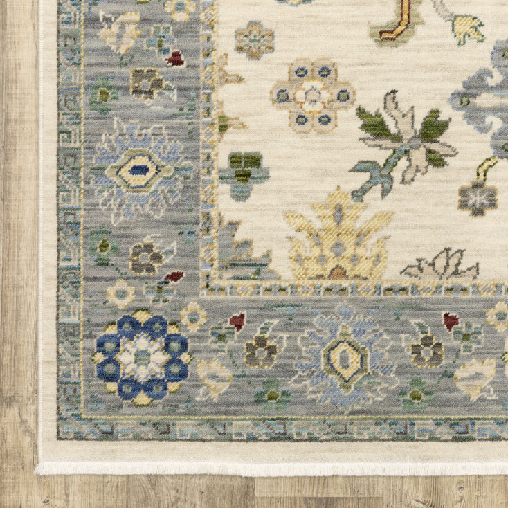6' x 9' Ivory Blue Grey Teal Gold Green and Rust Oriental Power Loom Area Rug with Fringe